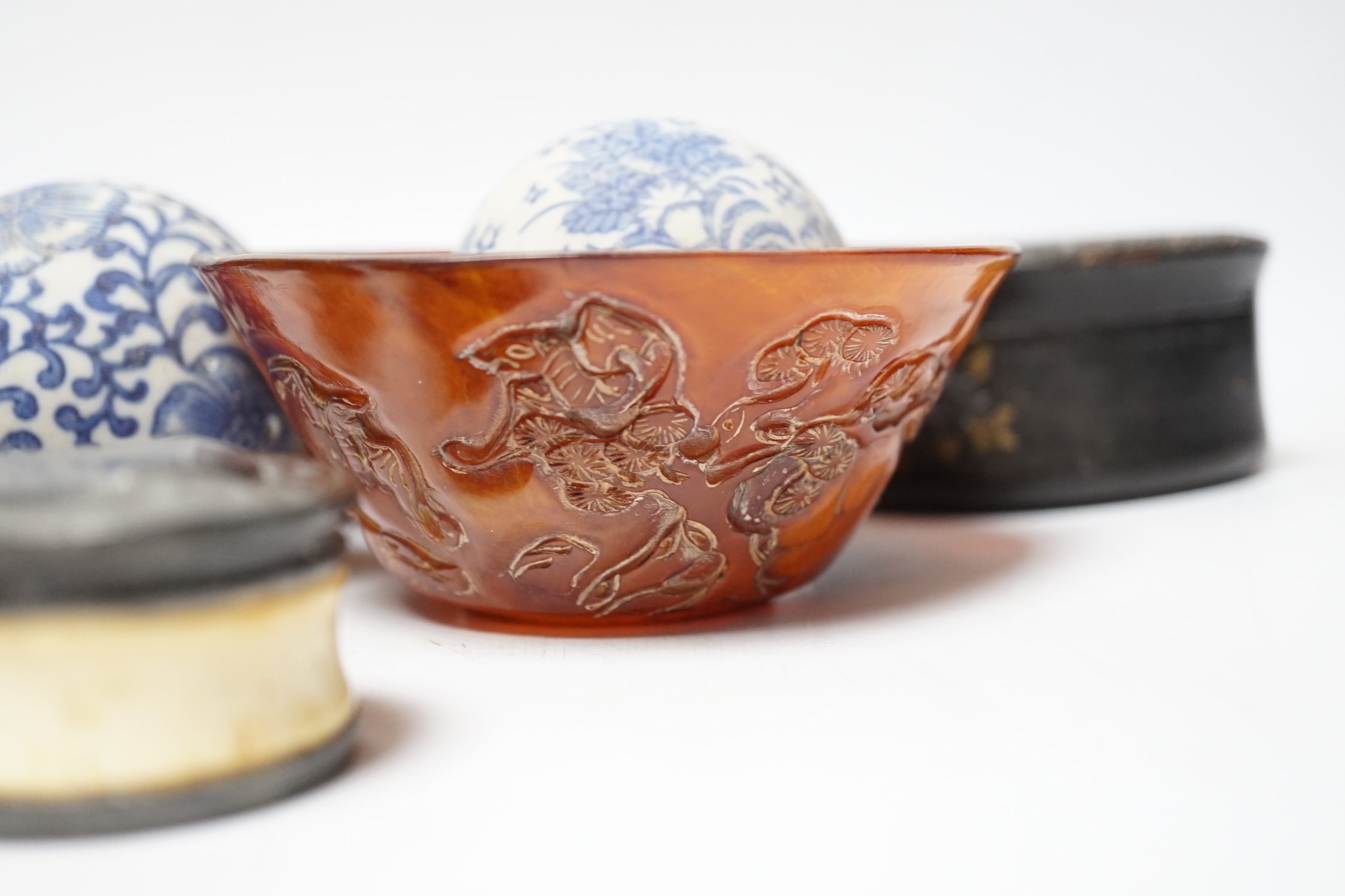 Eleven Chinese or Japanese items including; a bowl, a red lacquer box, an agate carving of a bird group, a carved hardstone lion tortoise, mother of pearl counters, etc.